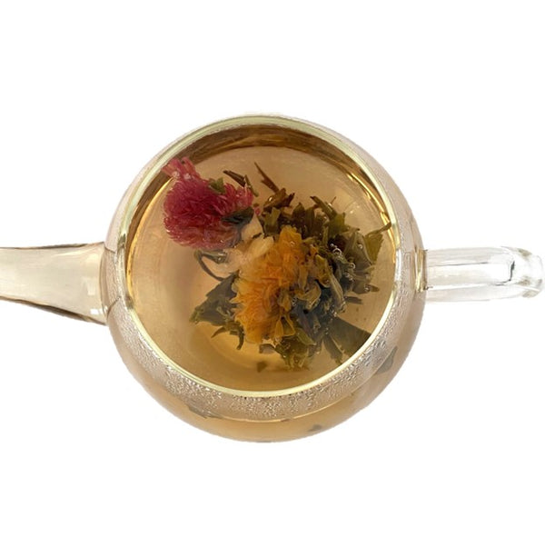 Green flowering tea with strings of white, yellow and pink flowers